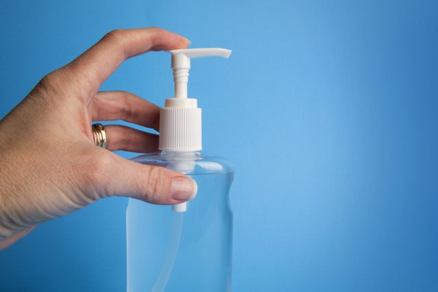 Bottle of Hand Sanitizer on Blue